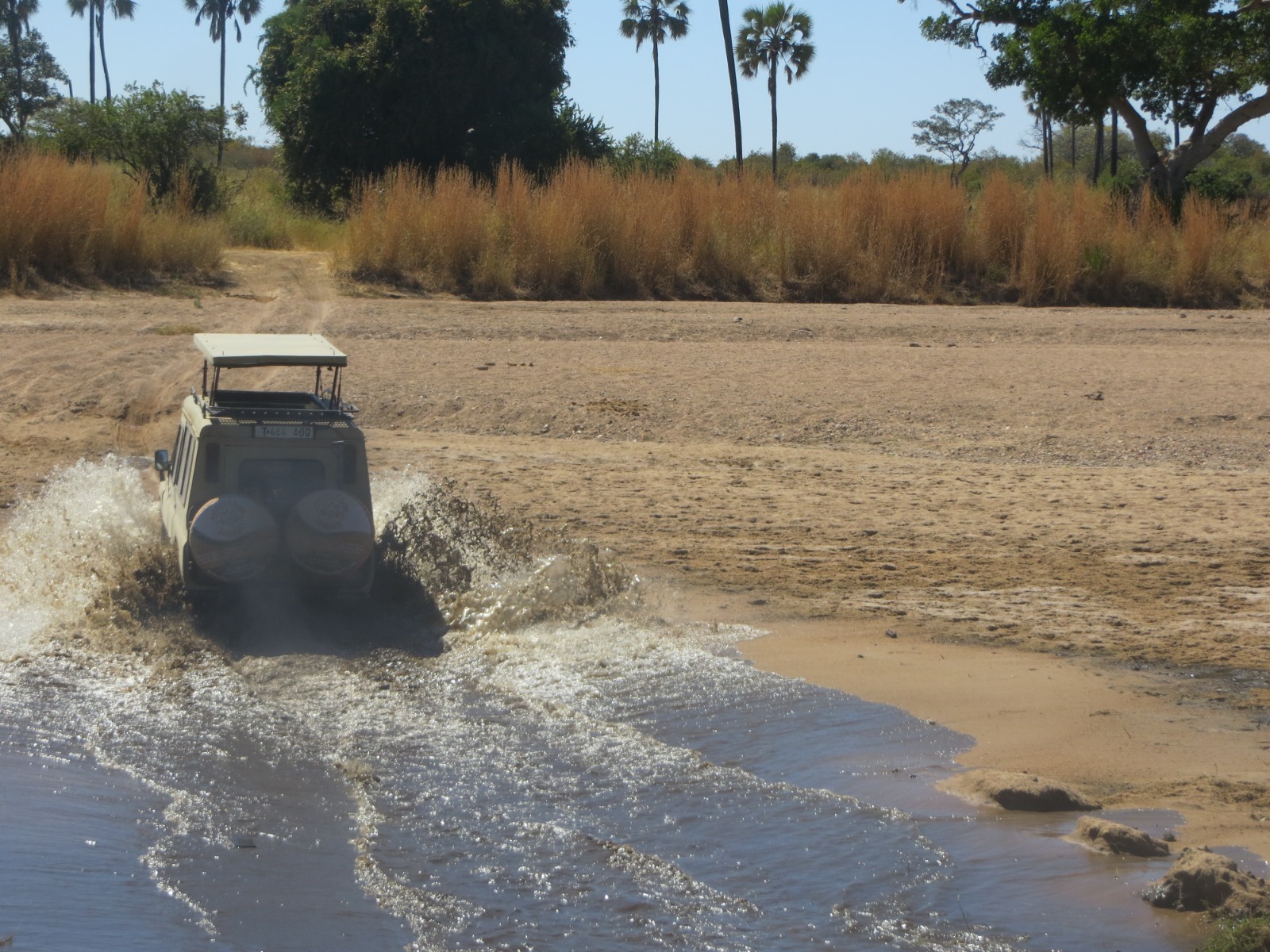 Safari vehicle on the Tanzanian plains